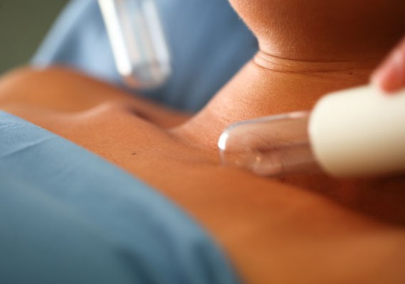 Woman getting post surgery therapy with Lympstar Pro