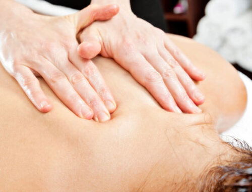 Woman getting Acupuncture Therapeutic Massage